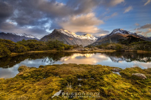 Morning reflections of Mt Christina and the Darran Mountains, from the Key Summit Tarns. Routeburn Track, Fiordland New Zealand